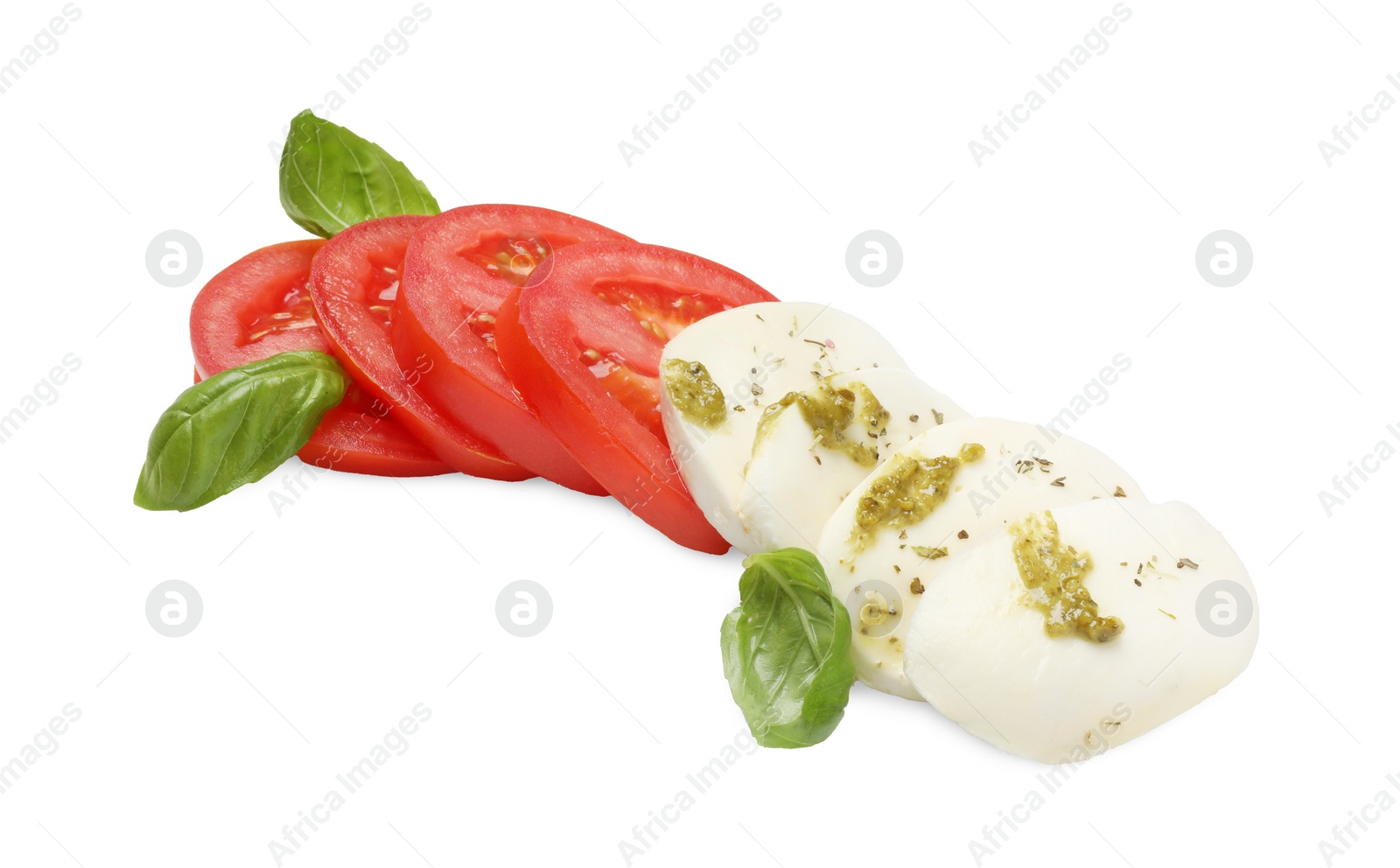 Photo of Tasty salad Caprese with mozzarella, tomatoes, basil and pesto sauce isolated on white