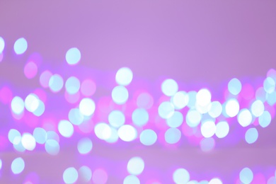 Photo of Beautiful glowing lights as background. Bokeh effect