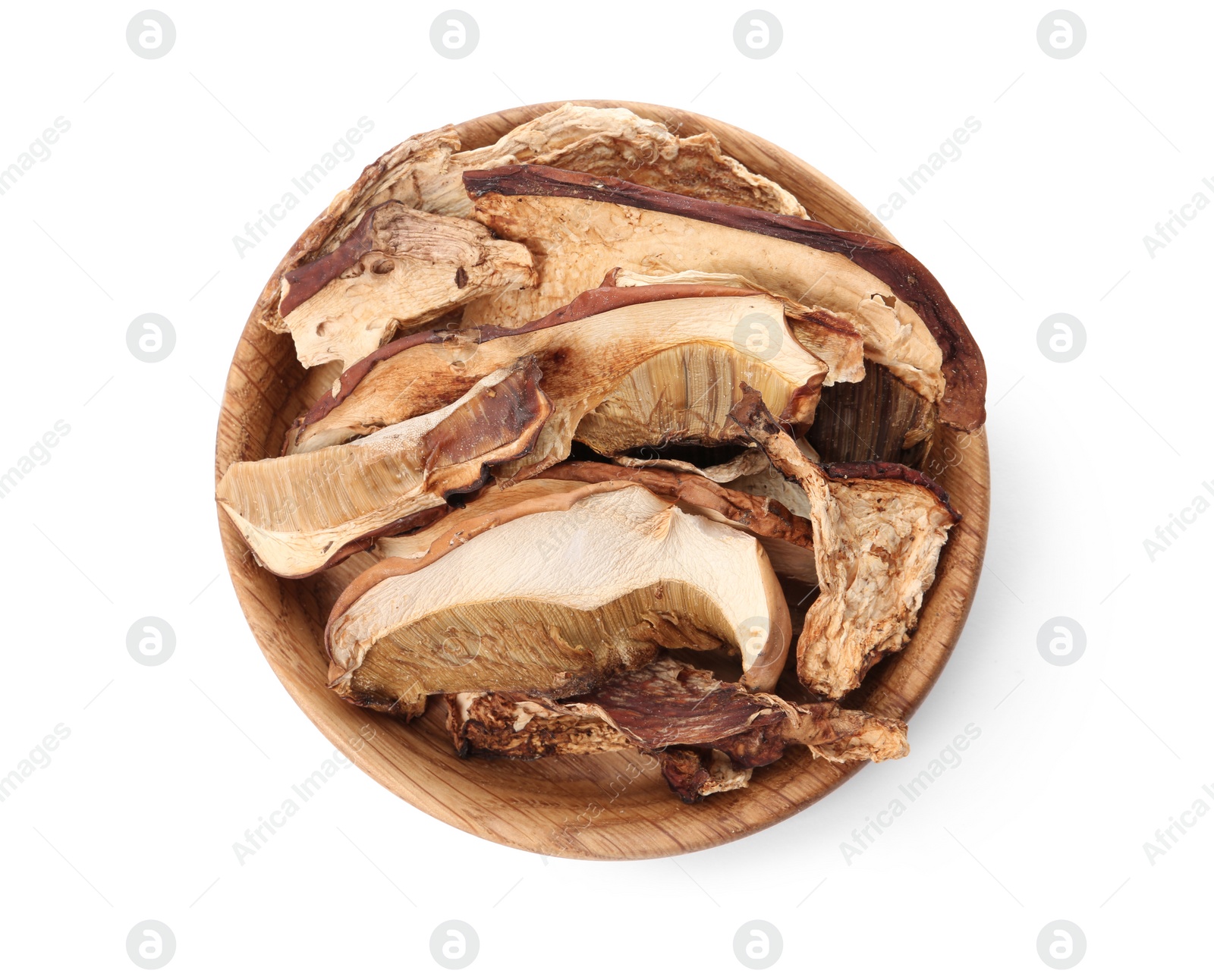 Photo of Plate of dried mushrooms isolated on white, top view