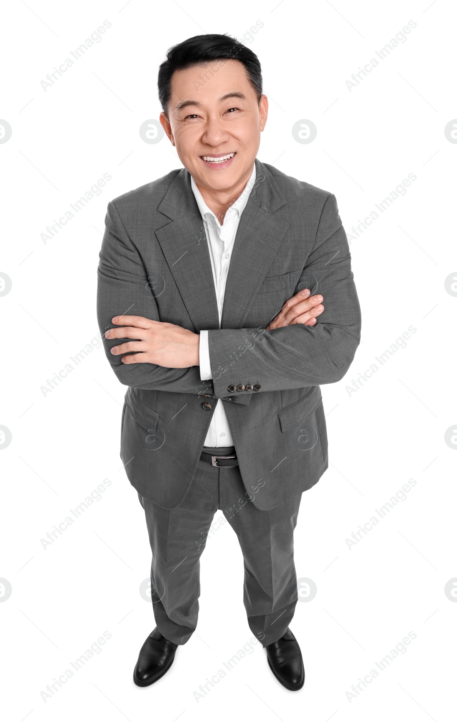 Photo of Businessman in suit posing on white background, above view