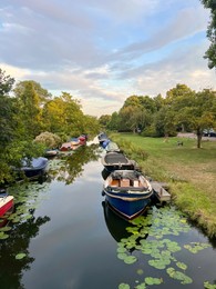 Photo of Beautiful view of moored boats in canal on sunny day