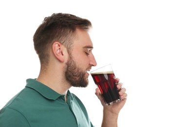 Handsome man with cold kvass on white background. Traditional Russian summer drink