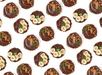 Image of Set of puffed corn cakes with chocolate spread on white background, top view. Pattern design