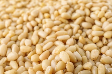 Pile of pine nuts as background, closeup