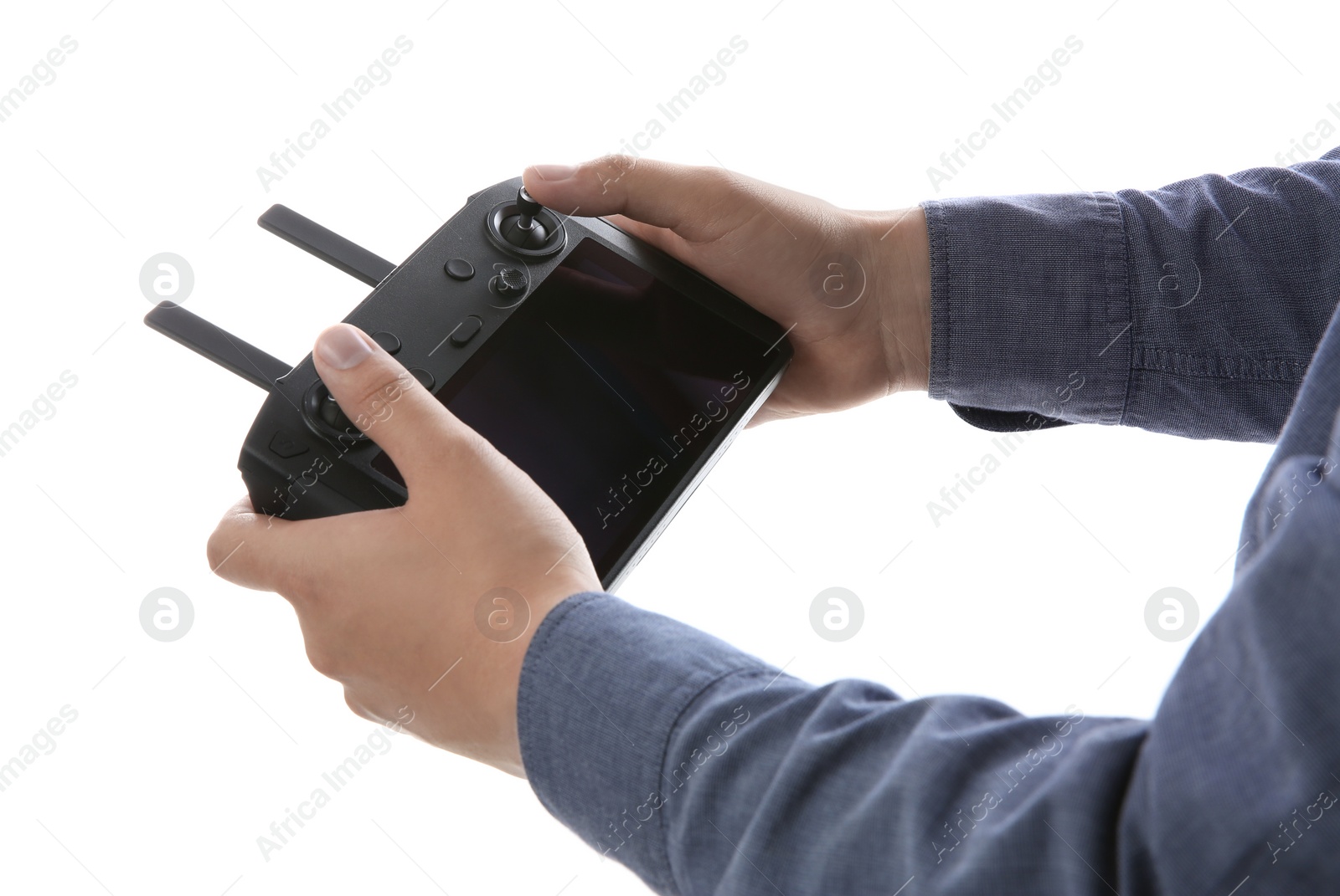 Photo of Man holding new modern drone controller on white background, closeup of hands