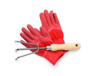 Photo of Gardening gloves and rake isolated on white, top view