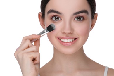 Photo of Teenage girl with makeup brush on white background