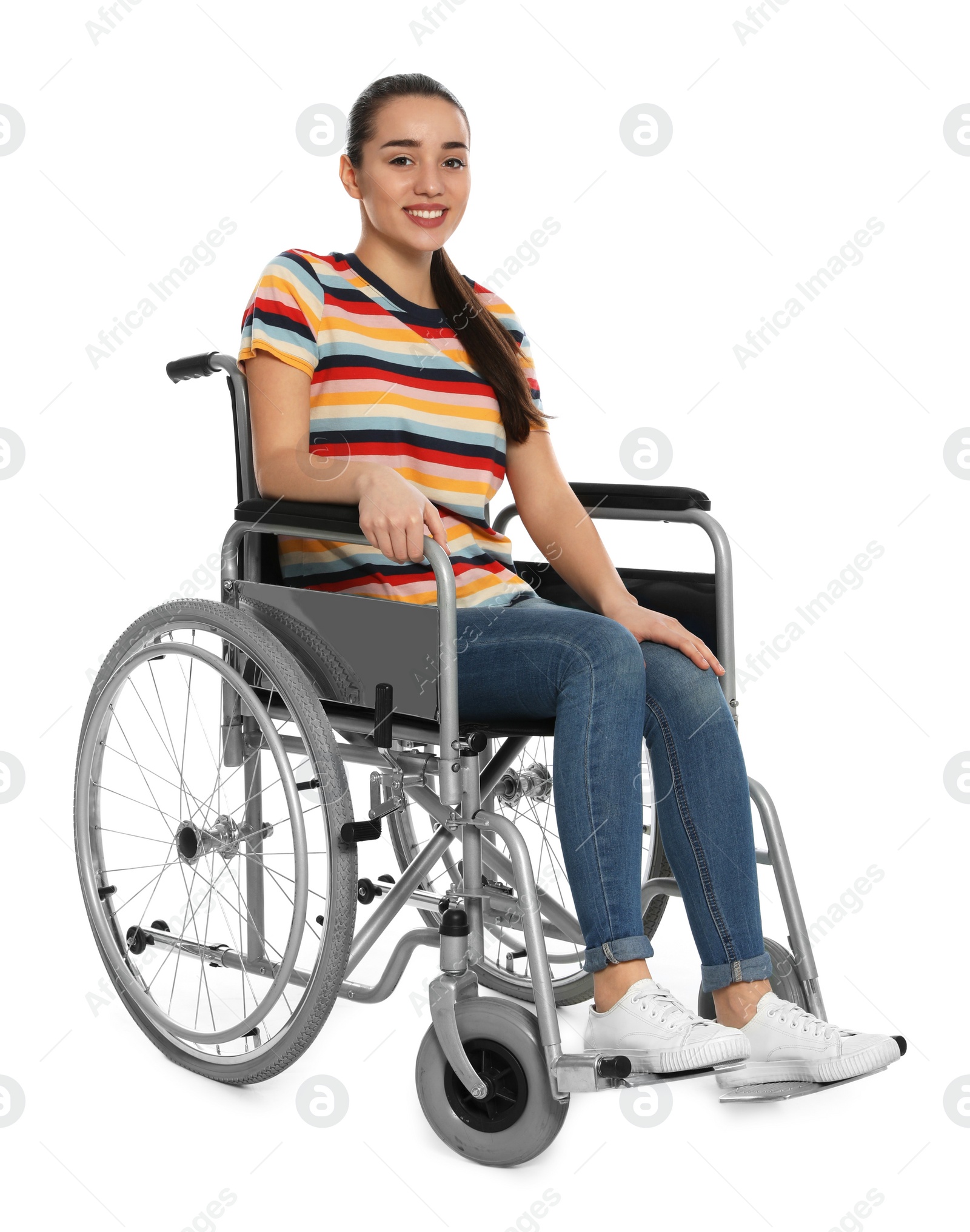 Photo of Young woman in wheelchair isolated on white