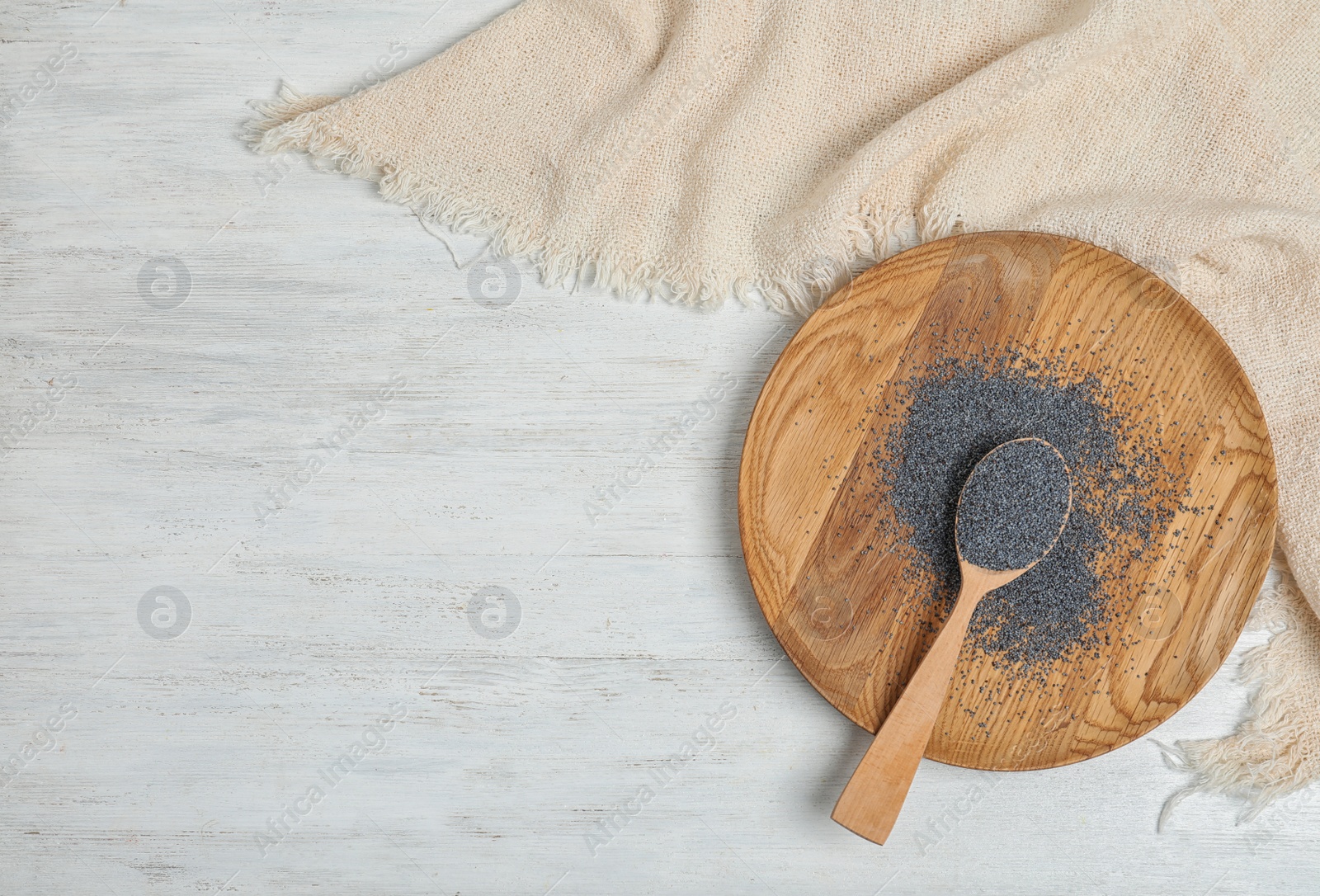 Photo of Flat lay composition with poppy seeds and space for text on white wooden background