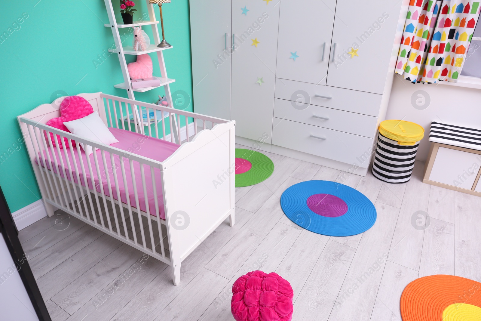 Photo of Light baby room interior with crib