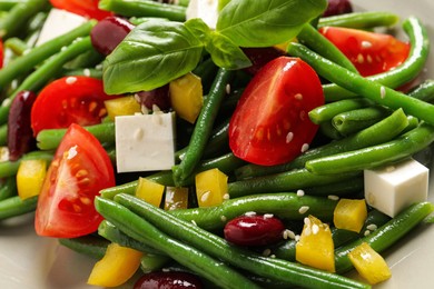 Photo of Tasty salad with green beans as background, closeup