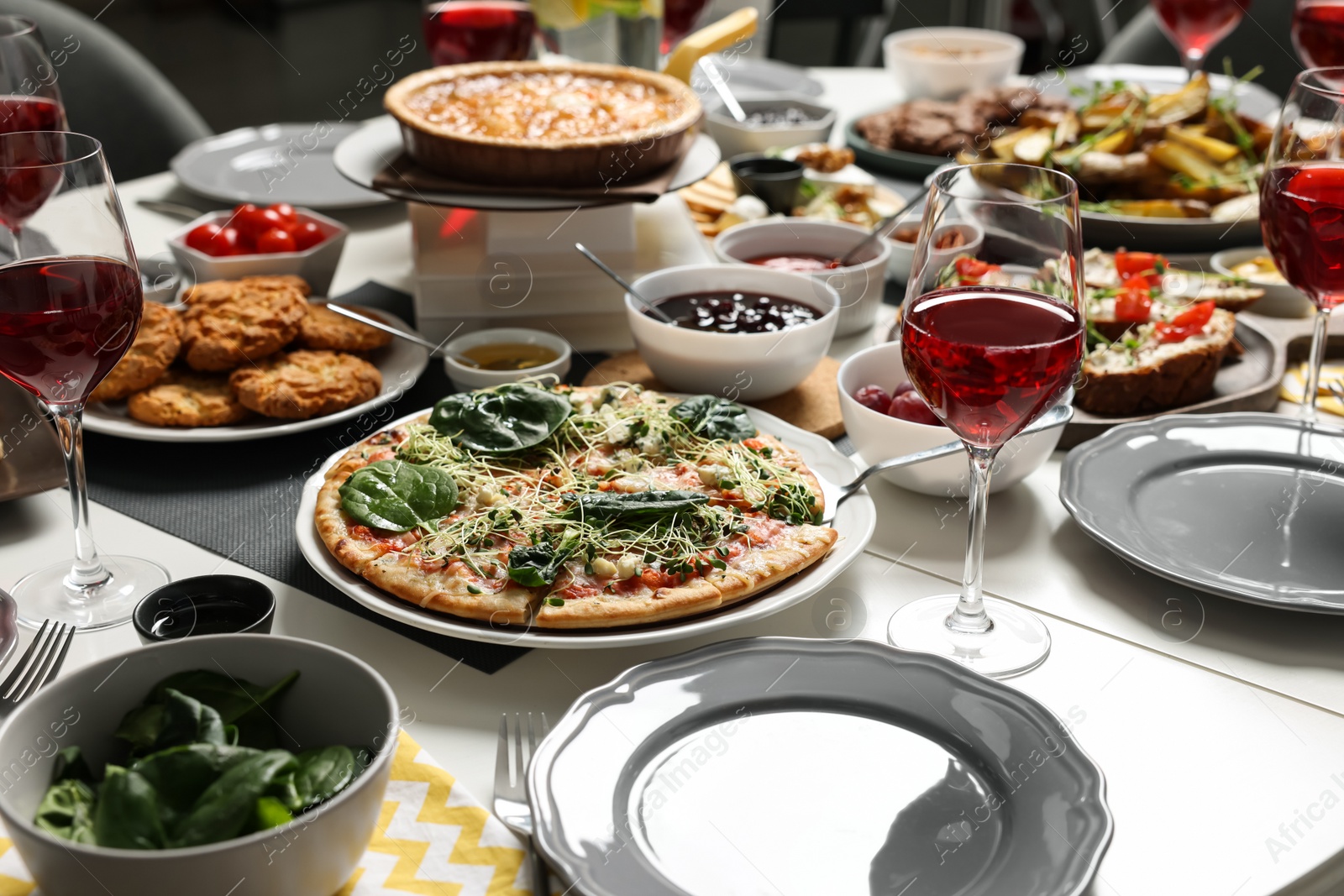 Photo of Brunch table setting with different delicious food indoors