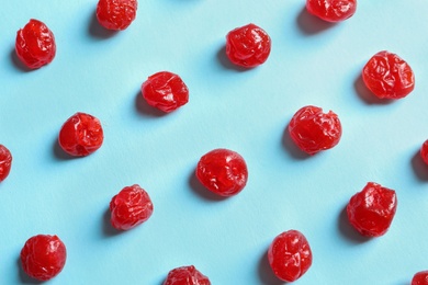 Photo of Flat lay composition of cherries on color background, closeup. Dried fruit as healthy snack