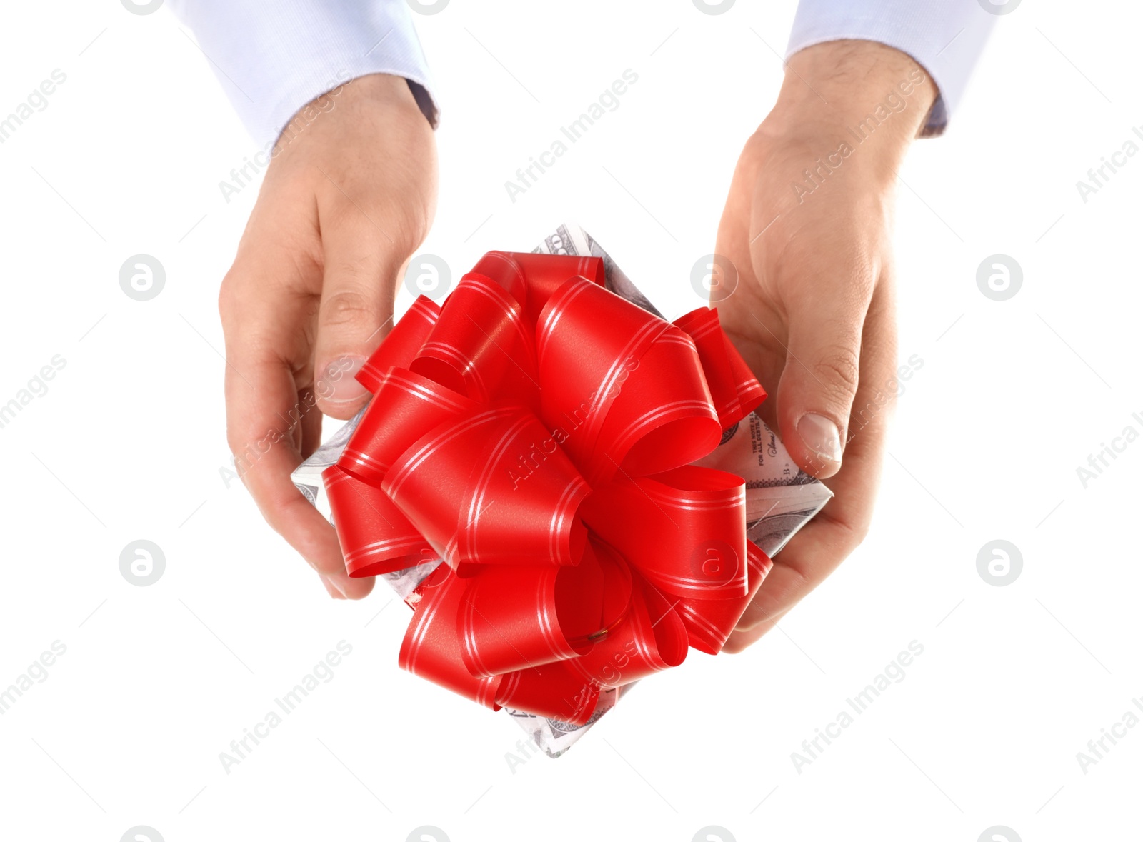 Photo of Man holding gift box wrapped in decorative paper with dollar pattern on white background
