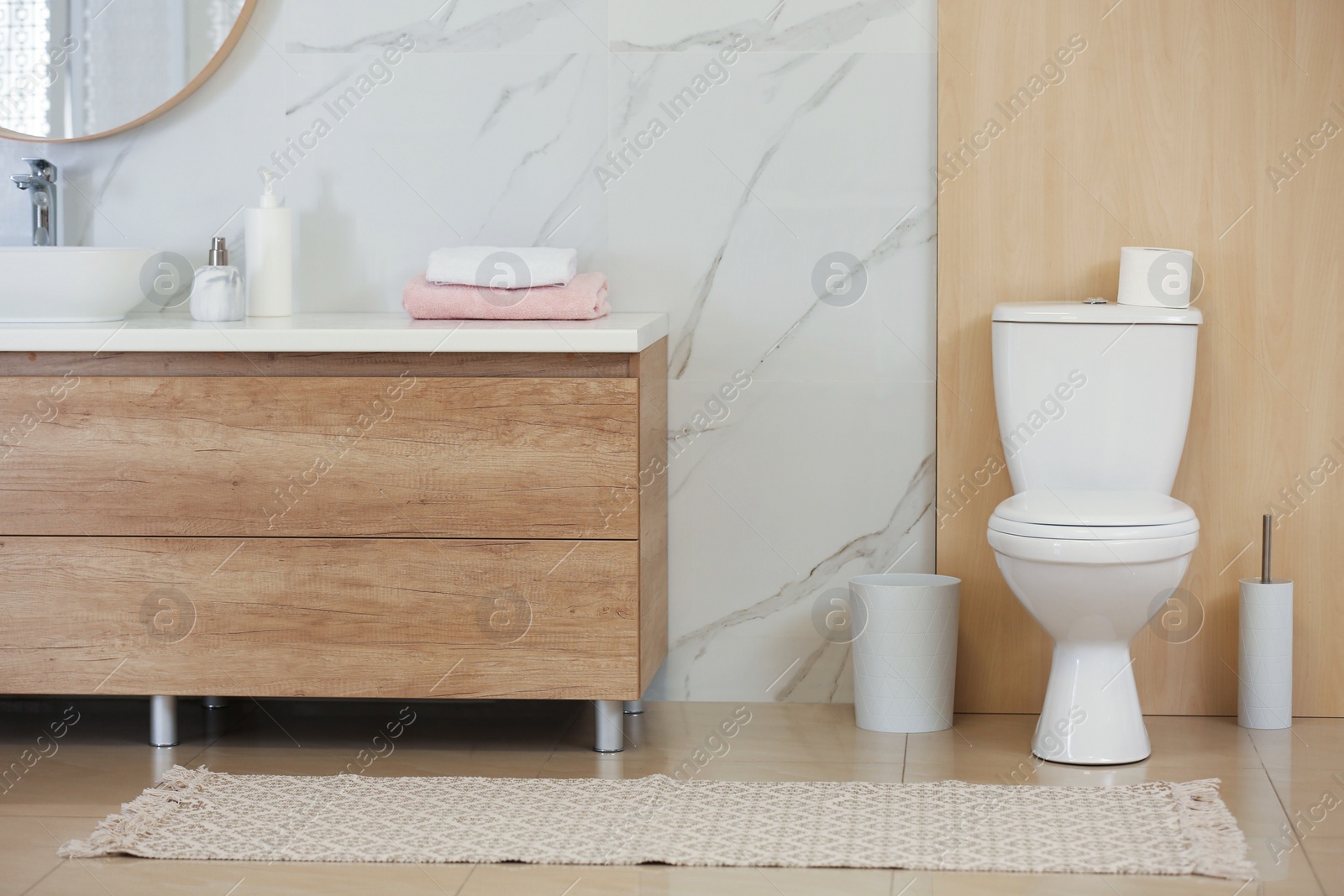 Photo of Interior of modern bathroom with toilet bowl