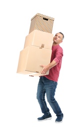 Full length portrait of mature man carrying carton boxes on white background. Posture concept