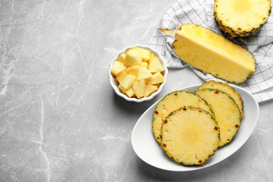 Photo of Composition with fresh sliced pineapple on table