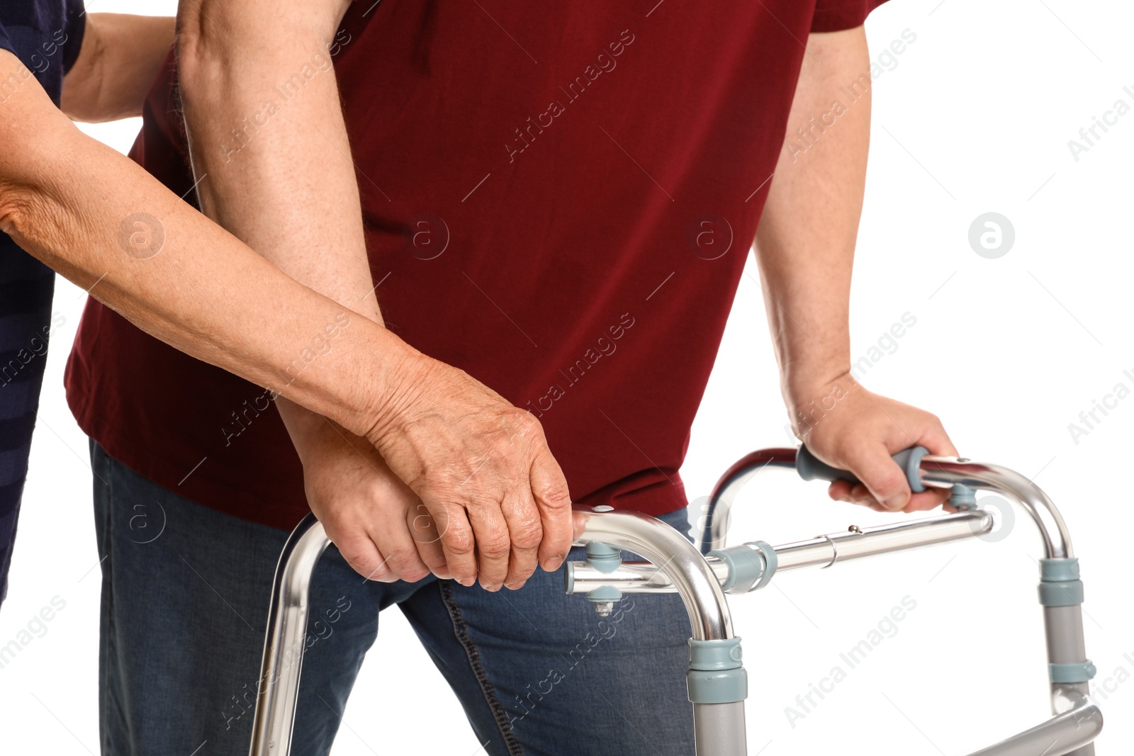 Photo of Elderly woman helping her husband with walking frame on white background, closeup