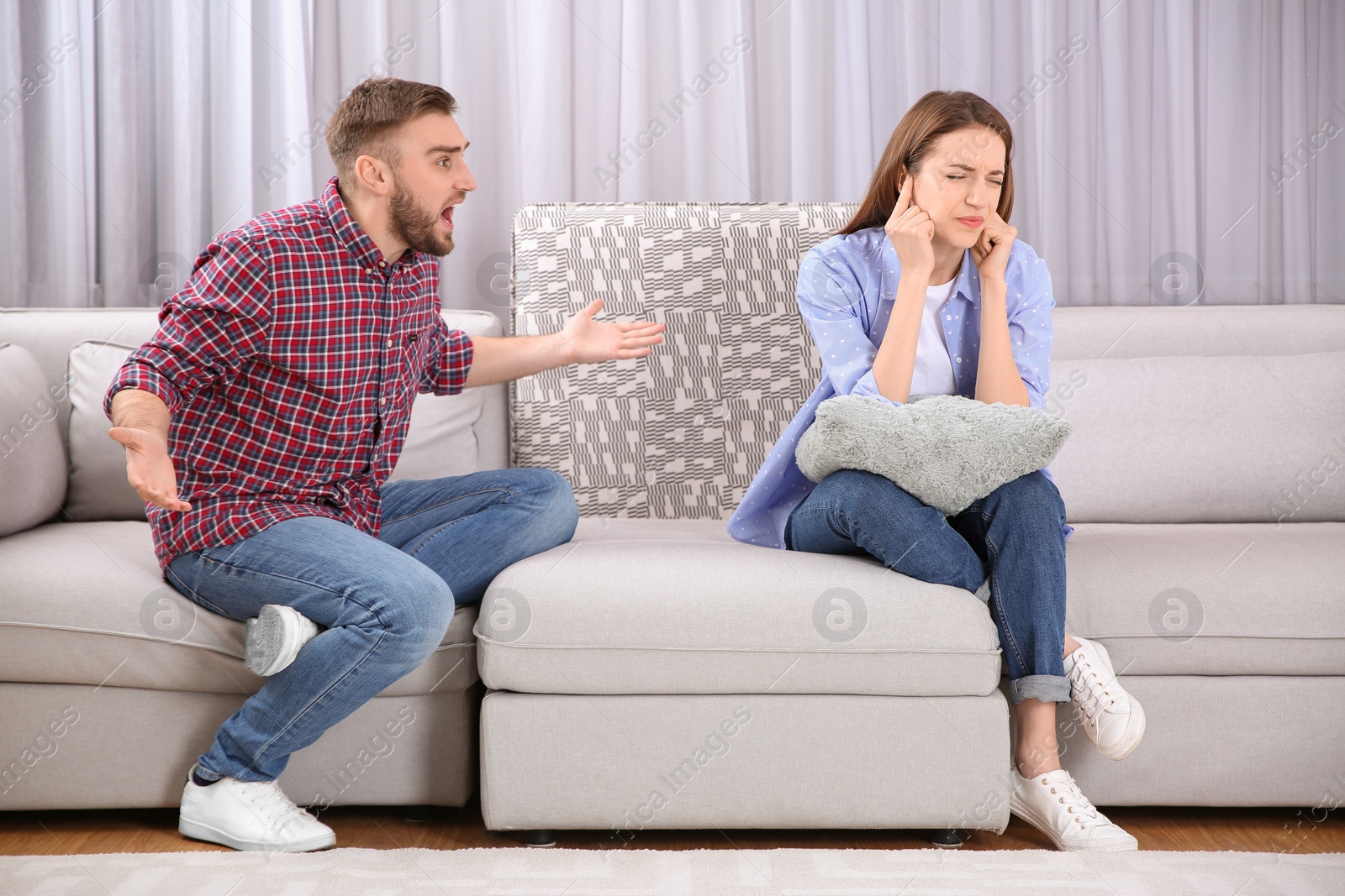 Photo of Couple having quarrel at home. Relationship problems