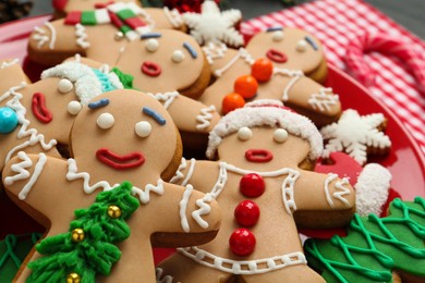 Photo of Delicious Christmas cookies and candy on table, closeup