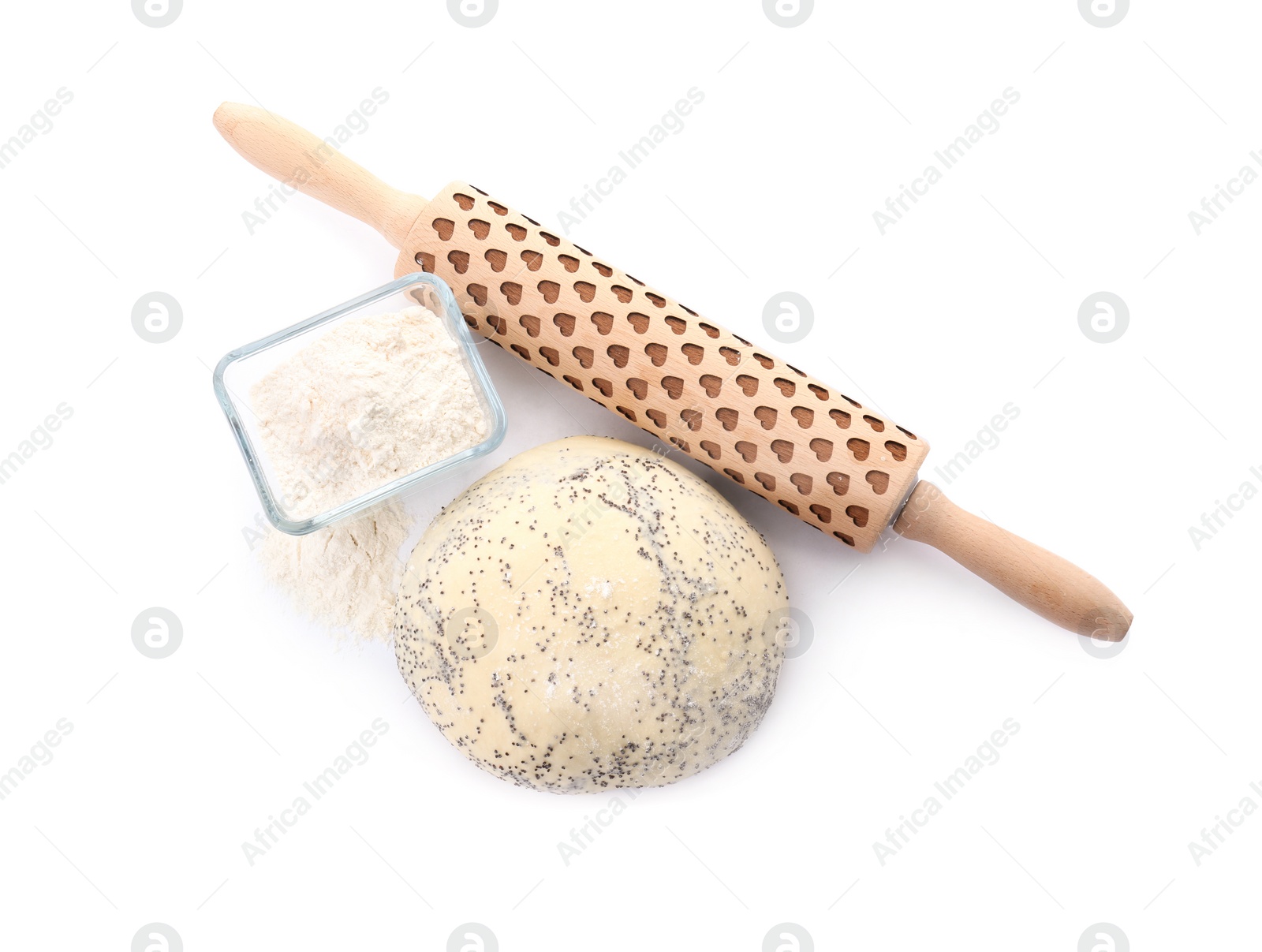 Photo of Raw dough with poppy seeds, flour in bowl and rolling pin on white background