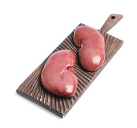 Photo of Wooden board with fresh raw pork kidneys on white background