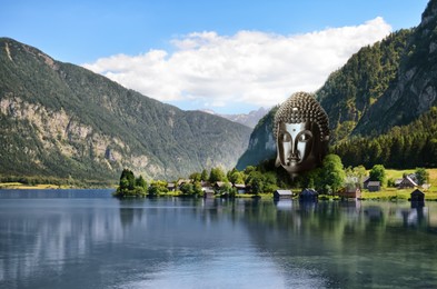 Image of Majestic Buddha sculpture near lake and mountains on sunny day 