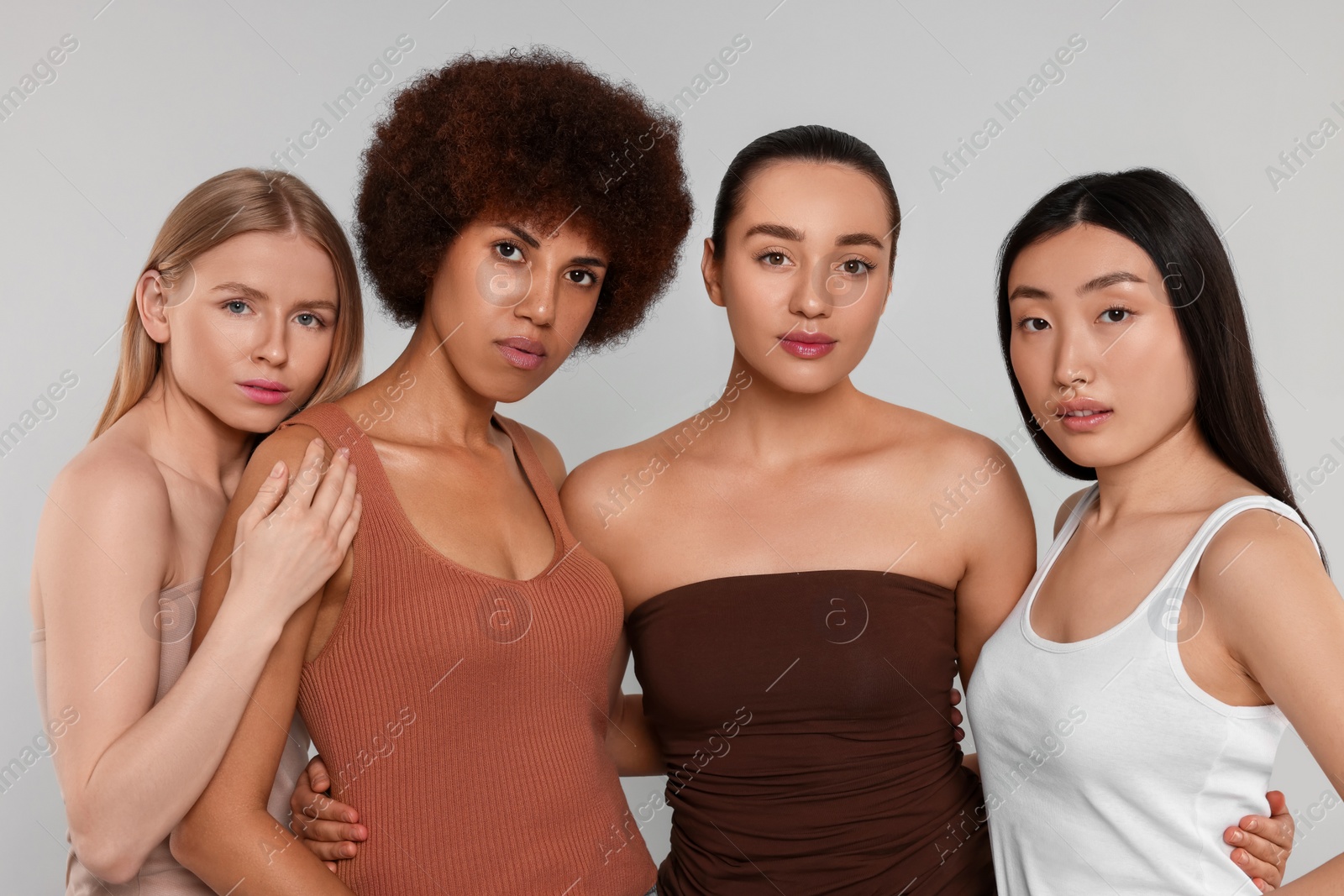 Photo of Portrait of beautiful young women on light grey background