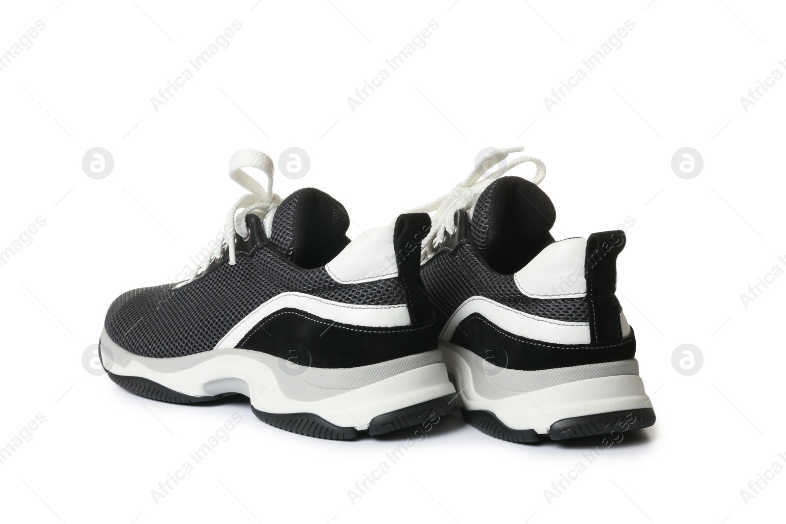 Photo of Pair of stylish modern training shoes on white background