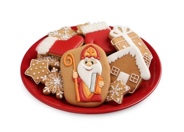 Photo of Tasty gingerbread cookies on white background. St. Nicholas Day celebration
