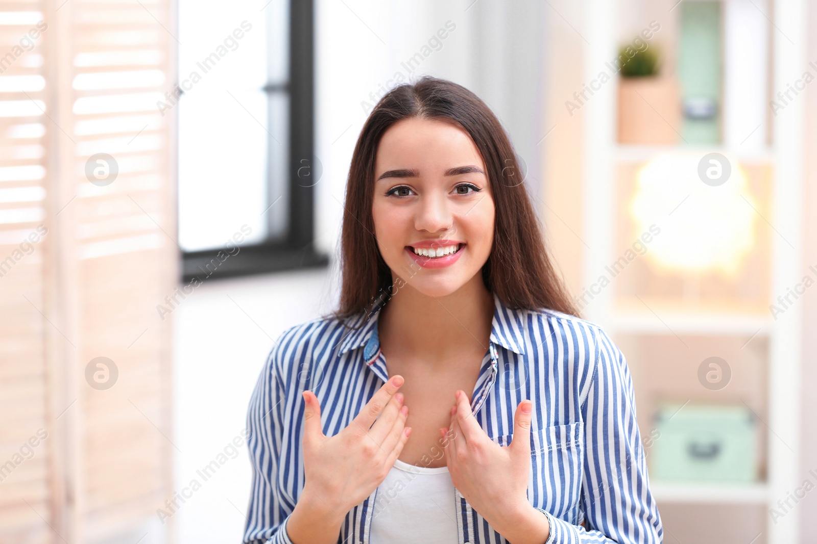 Photo of Beautiful woman using video chat for conversation indoors