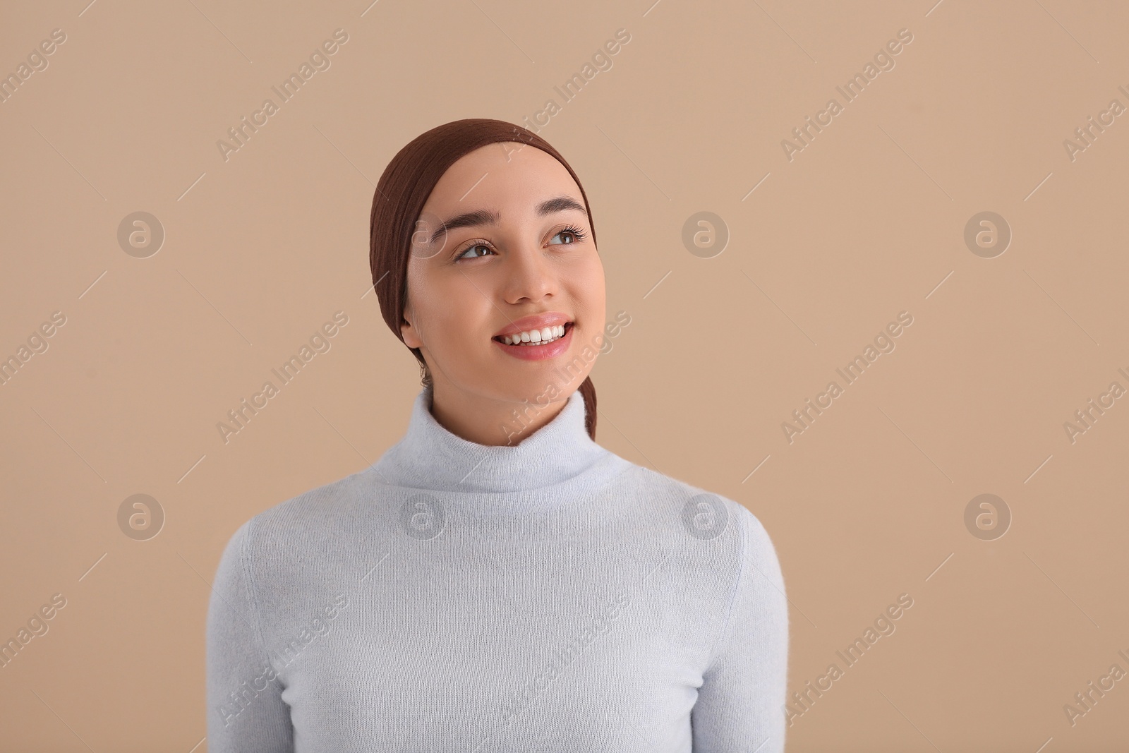 Photo of Smiling woman with cancer on beige background. Space for text
