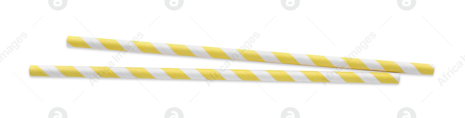 Photo of Striped paper cocktail straws on white background, top view