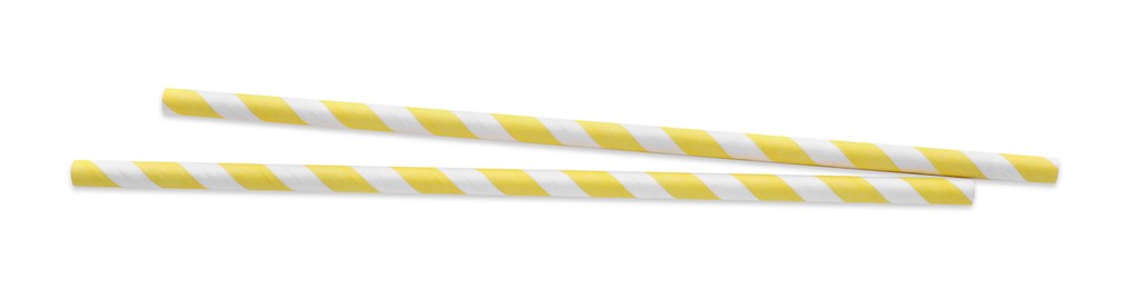 Photo of Striped paper cocktail straws on white background, top view