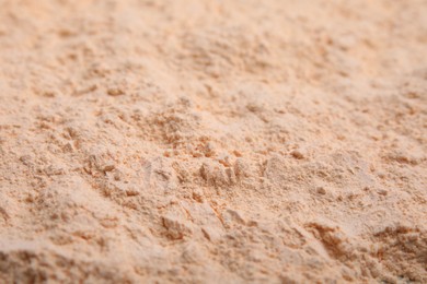 Photo of Organic lentil flour as background, closeup view