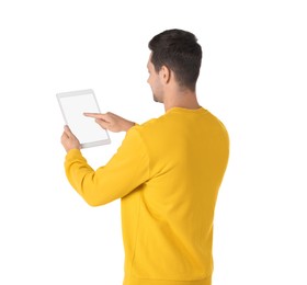 Man using tablet with blank screen on white background