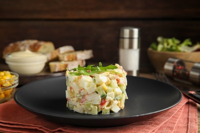 Photo of Delicious salad with crab sticks on table, closeup