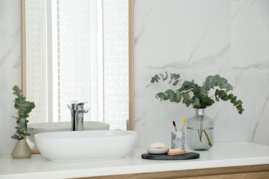 Photo of Modern bathroom interior with large mirror and vessel sink