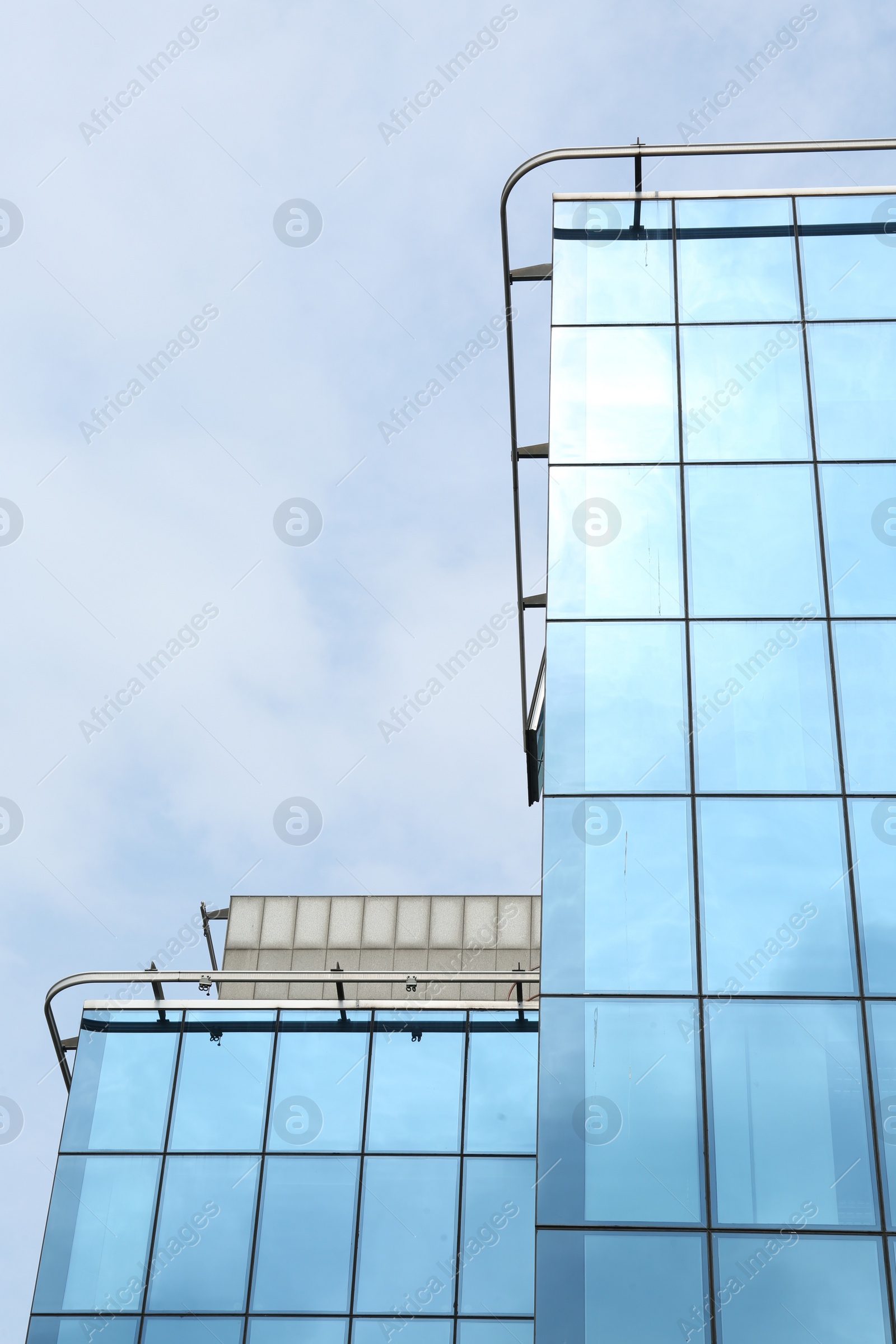 Photo of Modern building against blue sky. Urban architecture