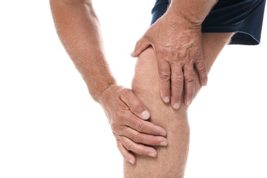 Photo of Senior man having knee problems on white background, closeup