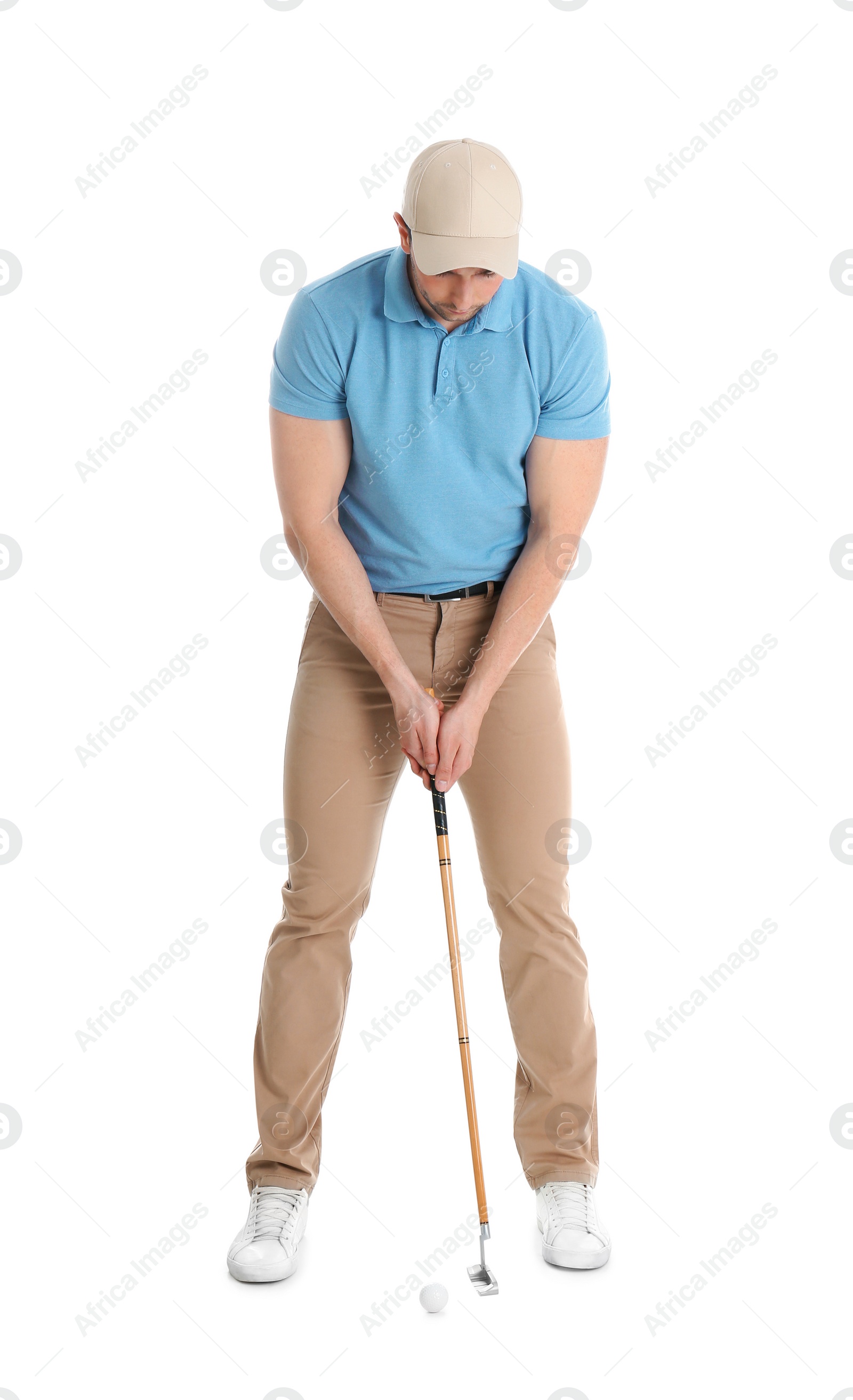 Photo of Young man with golf club and ball isolated on white