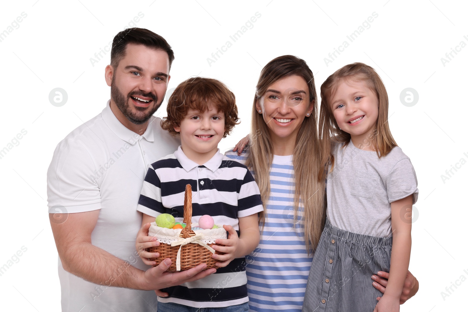 Photo of Easter celebration. Happy family with wicker basket full of painted eggs isolated on white