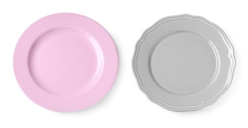 Different ceramic plates on white background, top view