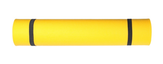 Photo of Yellow rolled camping or exercise mat on white background, top view