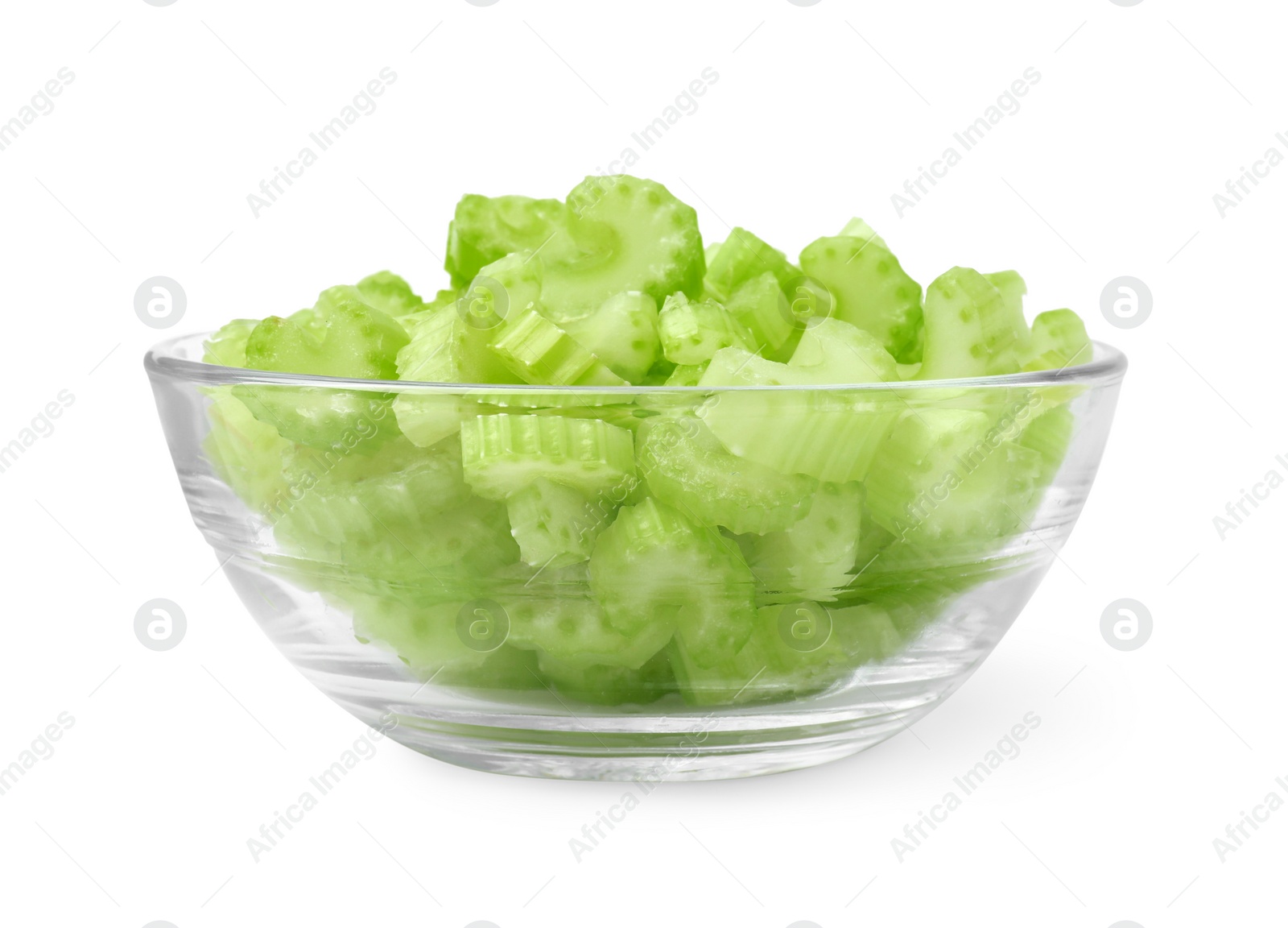 Photo of Glass bowl of fresh cut celery isolated on white