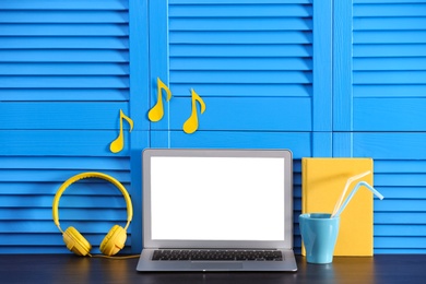 Photo of Modern laptop on desk in room, space for design. Home workplace