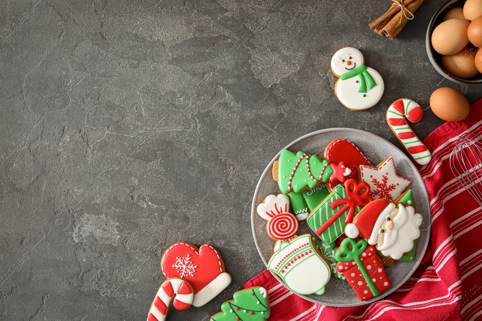 Photo of Flat lay composition with delicious homemade Christmas cookies on grey table. Space for text