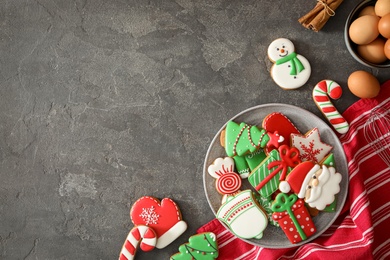 Flat lay composition with delicious homemade Christmas cookies on grey table. Space for text