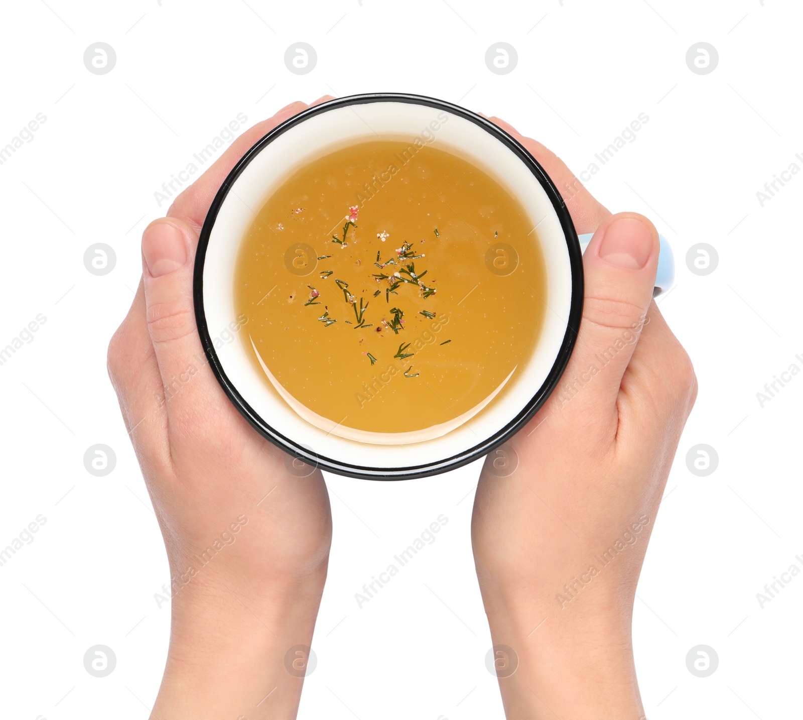 Photo of Woman with cup of hot delicious bouillon on white background, top view