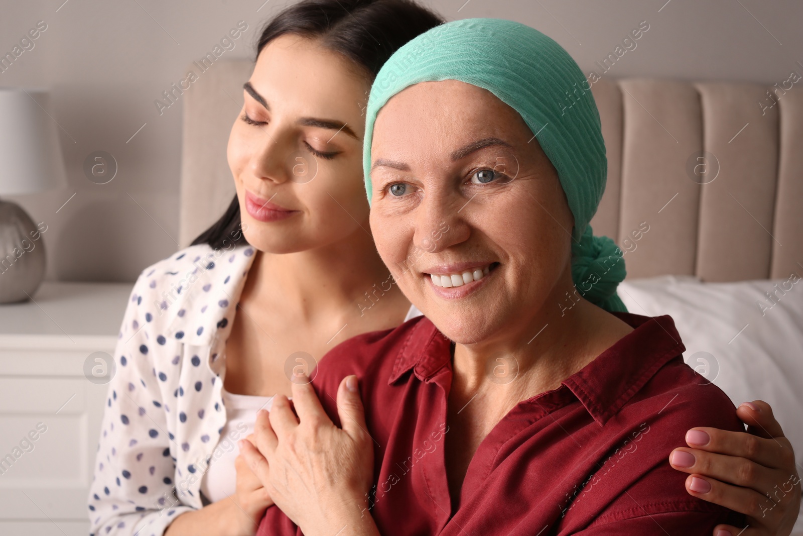 Photo of Young woman visiting her mother with cancer indoors